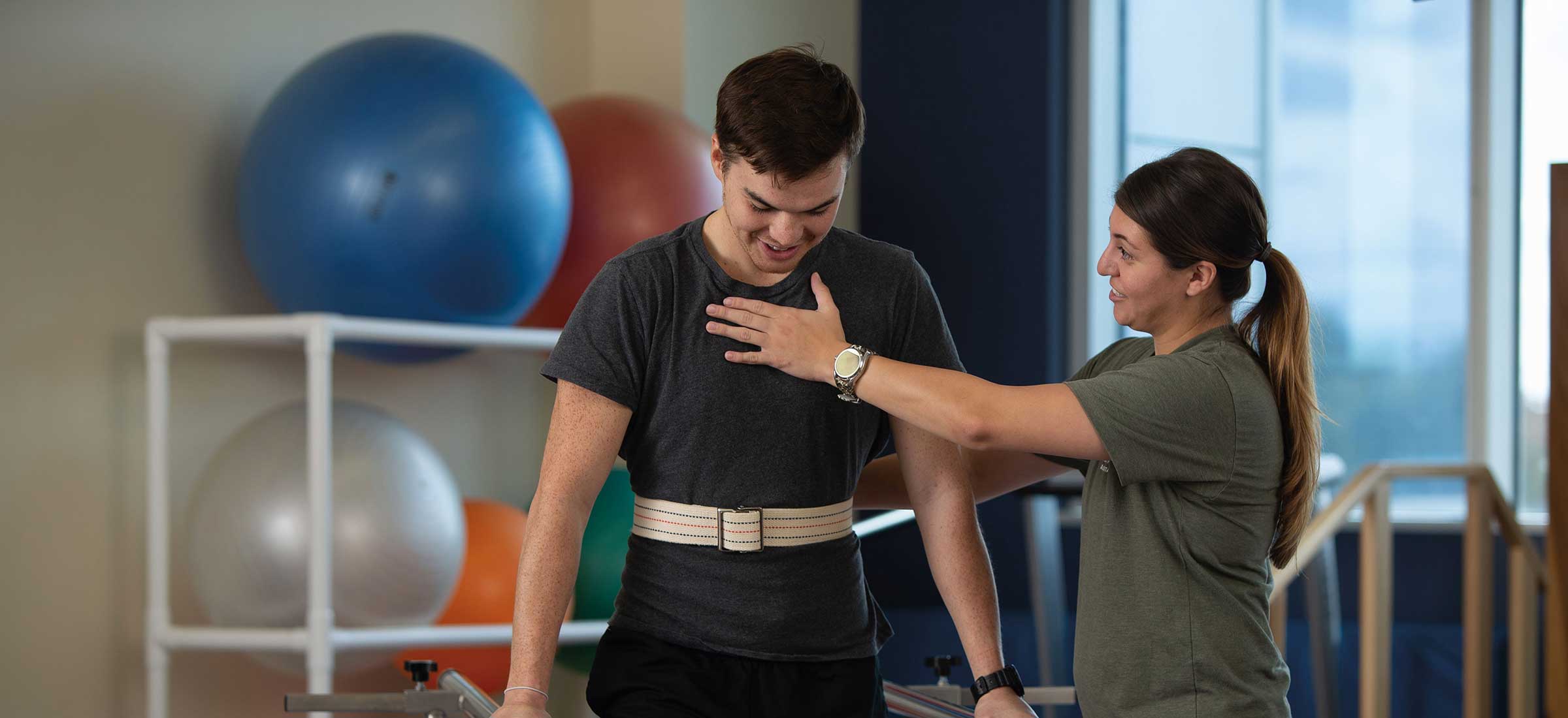 Physical Therapist Assistant helps patient